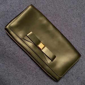 Black leather Kate Spade clutch purse